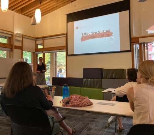 Photo of Sam Roberts, Be Happy Remote Founder facilitating an in-person workshop live.